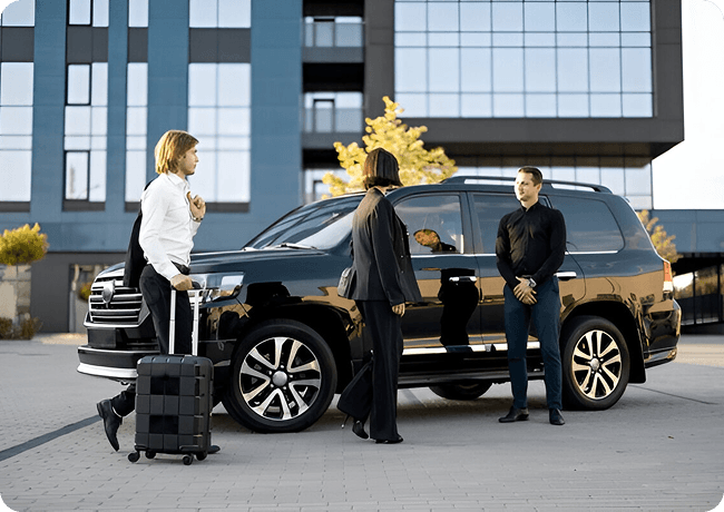 Private chauffeur driving a client through the city in a Genius Limo sedan