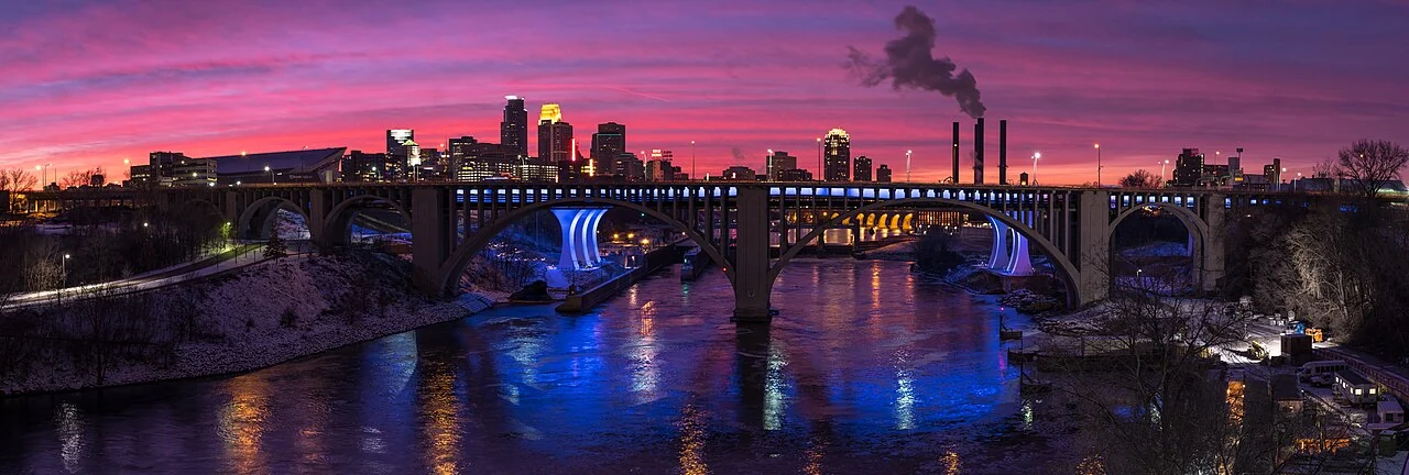 Minneapolis skyline and Mississippi River bridges at sunset, Minnesota