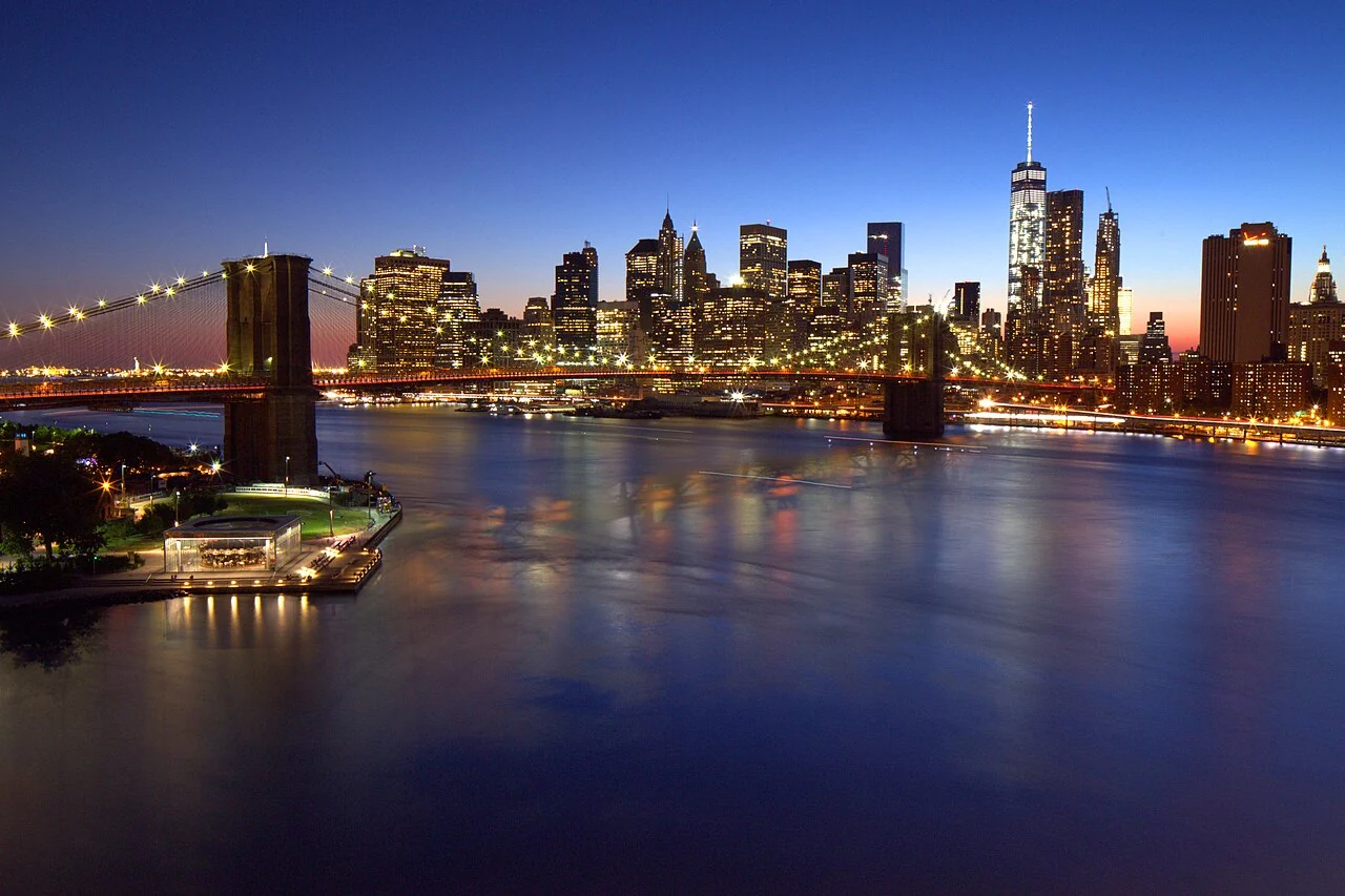Brooklyn Bridge and Lower Manhattan illuminated at blue hour, New York